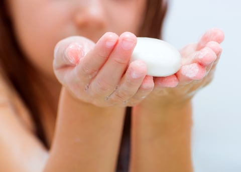 girl holding soap